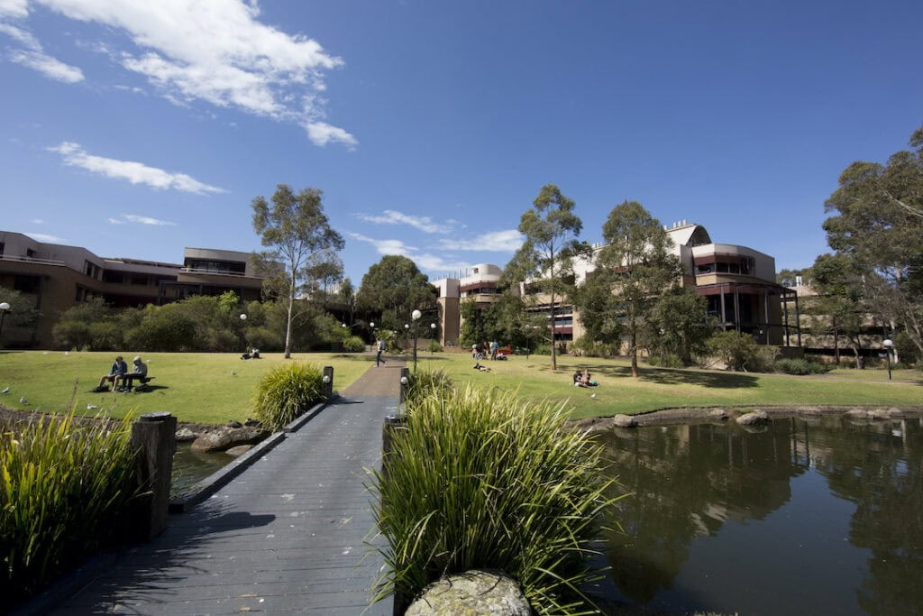 Students sprawled out on the lawn at the University of Wollongong